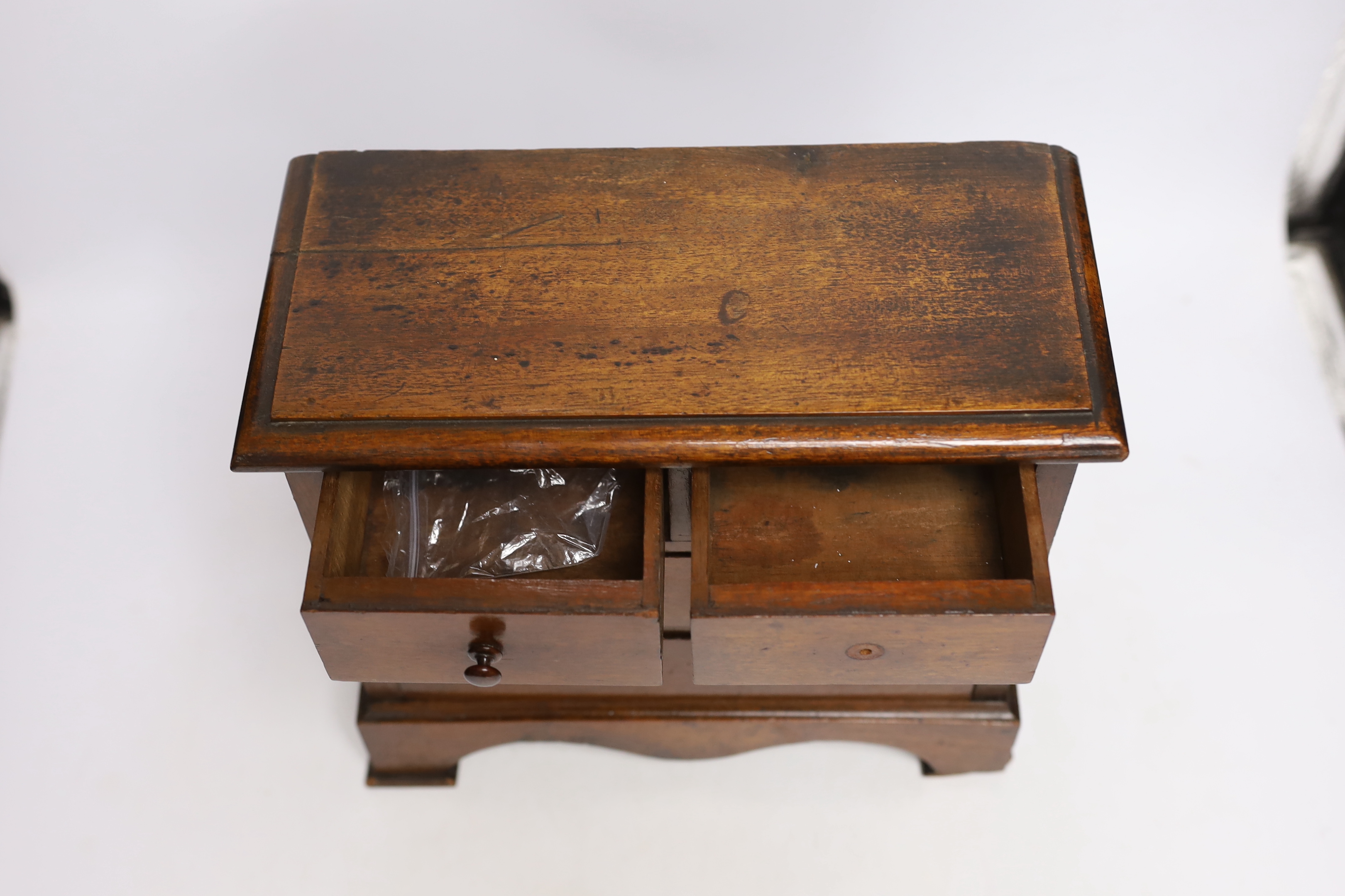 A Victorian miniature mahogany chest of drawers, 26cm high x 28cm wide